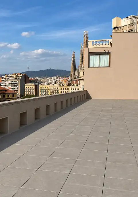 Terrace of a Barcelona building with Stone20-PMI® flooring and city views