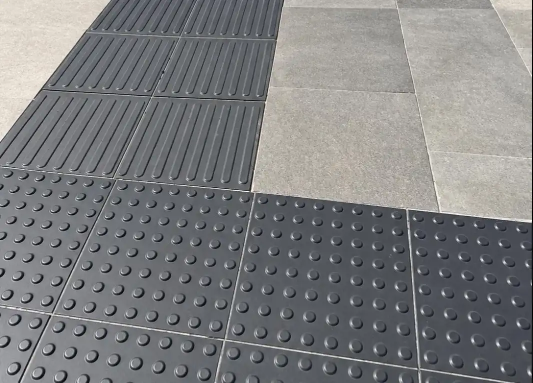 Tactile15® guidance and warning tiles meeting on outdoor flooring